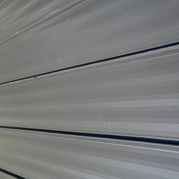 Slate gray metal roof panel color, close up